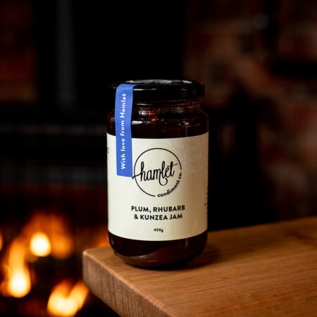 A 450g glass jar of plum, rhubarb and kunzea jam, with a seal sticker over the lid that reads With love from Hamlet.